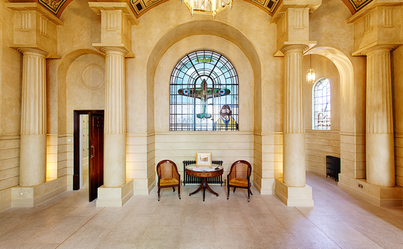 Stain glass window in the entrance hall, depicting a Spitfire airplane and pilot