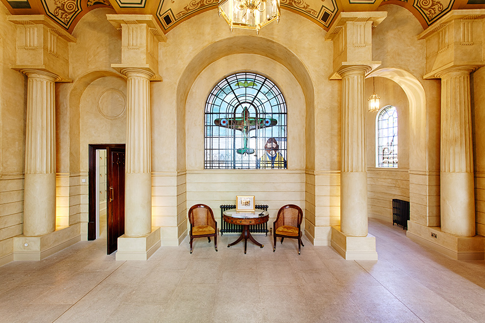Stain glass window in the entrance hall, depicting a Spitfire airplane and pilot
